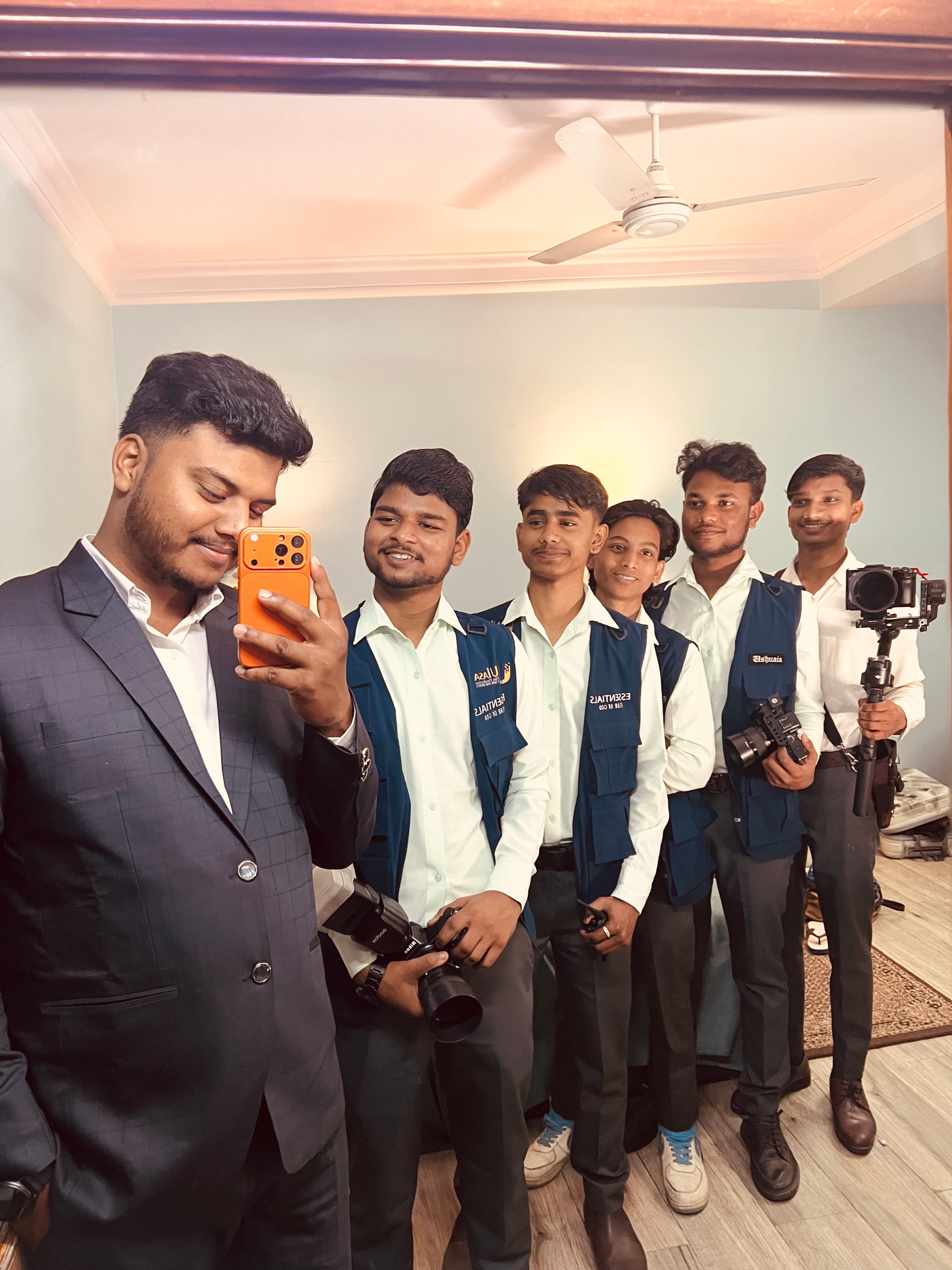 Professional photographer team posing in modern studio